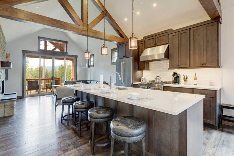 Homebuyers review a purchase offer and inspection documents at a kitchen table with a calculator and pen.